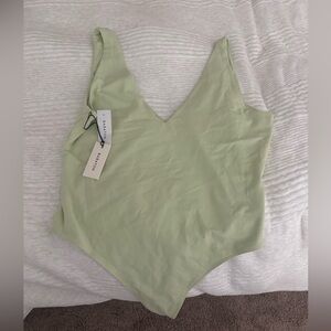 Babaton Body Suit- NWT. Never worn; only tried on TTS